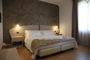 Voodi või voodid majutusasutuse Monte San Giovanni-Nebrodi Rooms toas