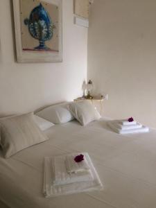 Postel nebo postele na pokoji v ubytování Casa Adele - Dimora del 1700 nel centro storico