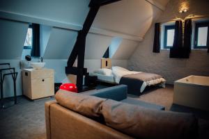 Postel nebo postele na pokoji v ubytování Auberge de l'Abbaye