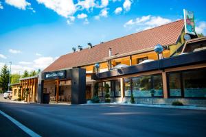 an empty street in front of a building at Gostisce Ulipi in Slovenske Konjice