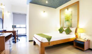 Letto o letti in una camera di Treebo Edha Suites Koramangala