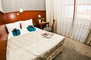Postel nebo postele na pokoji v ubytování Hotel&Spa Stary Dziwnów basen swimming pool