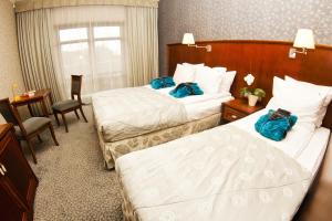 Postel nebo postele na pokoji v ubytování Hotel&Spa Stary Dziwnów basen swimming pool