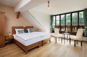 Voodi või voodid majutusasutuse Wellness Hotel Florián České Žleby toas