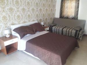 Postel nebo postele na pokoji v ubytování SEAVIEW Marsascala Apartment