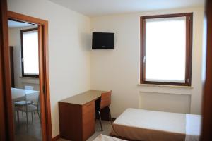 Postel nebo postele na pokoji v ubytování Suite Maria + 6 fotografií