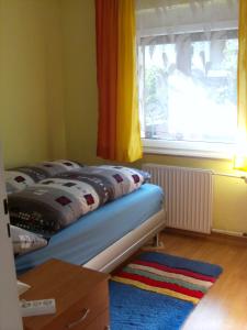 Postel nebo postele na pokoji v ubytování Ferienwohnung Mörlenbach + 37 fotografií