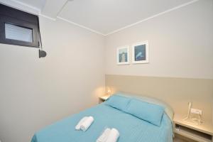 Ένα ή περισσότερα κρεβάτια σε δωμάτιο στο Apartment Line One +46 φωτογραφίες