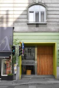 a green building with a stove in a window at Hotel Mocca in Vienna