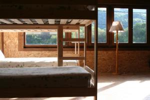 Postel nebo postele na pokoji v ubytování Albergue Les Xendes. Parque de Redes