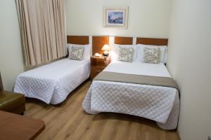 Katil atau katil-katil dalam bilik di Kafé Hotel