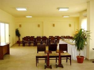 a waiting room with chairs and tables in a room at Bahga Palace 3 Residential Apartments in Hurghada