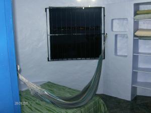 Et tv og/eller underholdning på Casa Canal em Cabo Frio