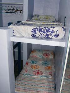 En eller flere senge i et værelse på Casa Canal em Cabo Frio