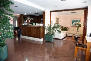 a living room with a couch and a table at San Domenico Hotel in Soverato Marina