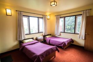 Voodi või voodid majutusasutuse Swayambhu View Guest House toas