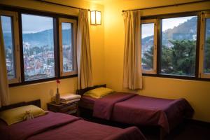 Voodi või voodid majutusasutuse Swayambhu View Guest House toas