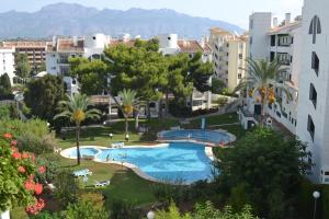 La alberca dentro o cerca de Apartamentos BCL Playa Albir