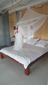 Un pat sau paturi într-o cameră la Grand Loft EM33