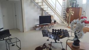 Un televizor și/sau centru de divertisment la Grand Loft EM33
