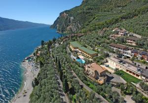 an aerial view of a resort next to the water at Hotel Mercedes in Limone sul Garda +67 photos