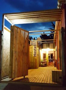 an open door to a deck at night at Treehouse Patagonia in Puerto Natales