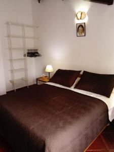 Säng eller sängar i ett rum på Finca La Esperanza Loma Linda