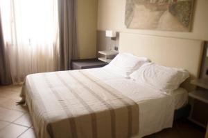 Postel nebo postele na pokoji v ubytování Holiday Rooms Antica Badia