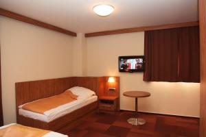 Postel nebo postele na pokoji v ubytování Hotel Marinšek