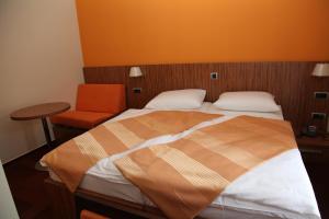 Postel nebo postele na pokoji v ubytování Hotel Marinšek