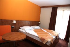 Postel nebo postele na pokoji v ubytování Hotel Marinšek