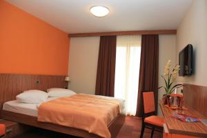 Postel nebo postele na pokoji v ubytování Hotel Marinšek