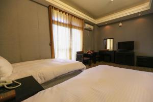 Postel nebo postele na pokoji v ubytování Wanli Spa & Resort