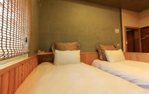 Postel nebo postele na pokoji v ubytování Wanli Spa & Resort