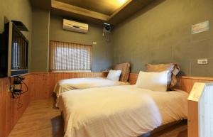 Postel nebo postele na pokoji v ubytování Wanli Spa & Resort