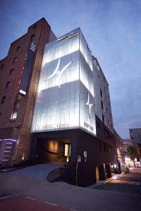 a building with a sign on the side of it at Healasis in Seongnam