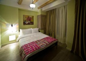 Postel nebo postele na pokoji v ubytování No12 Boutique Hotel