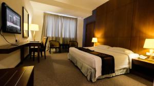 Postel nebo postele na pokoji v ubytování Times Hotel Brunei