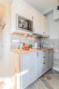 Kuchyňa alebo kuchynka v ubytovaní Apartamenty Rockus LUX & SPA Zakopane