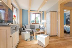 Televízia a/alebo spoločenská miestnosť v ubytovaní Apartamenty Rockus LUX & SPA Zakopane