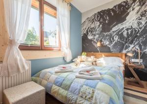 Posteľ alebo postele v izbe v ubytovaní Apartamenty Rockus LUX & SPA Zakopane