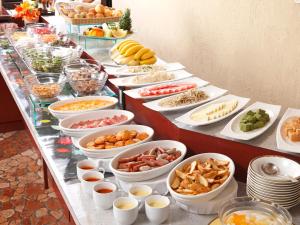 a buffet line with many different types of food at ANA Crowne Plaza Chiryu by IHG in Chiryu
