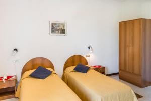 Katil atau katil-katil dalam bilik di Hotel Cristina