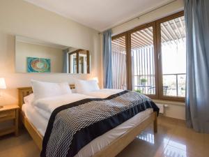 Posteľ alebo postele v izbe v ubytovaní VacationClub - Olympic Park Apartment 404 + 19 fotografií