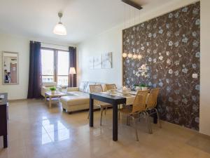 Posteľ alebo postele v izbe v ubytovaní VacationClub - Olympic Park Apartment 404