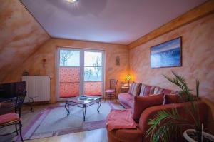 a living room with a couch and a table at Pferdehof Ranzow in Ranzow