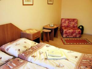 Postel nebo postele na pokoji v ubytování Hotel Štadión