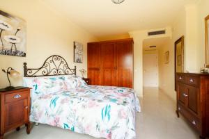 A bed or beds in a room at La Cartuja del Golf