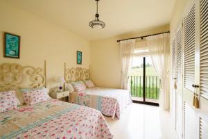 A bed or beds in a room at La Cartuja del Golf