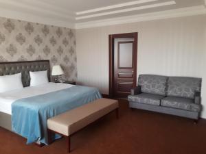 Postel nebo postele na pokoji v ubytování Sultan Plaza hotel